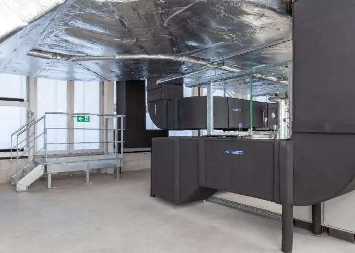 Commercial HVAC system with insulated ductwork in a modern building, ensuring efficient airflow and temperature control.